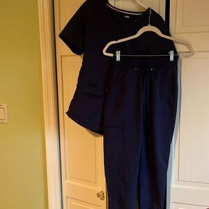 Scrub tops and bottoms size extra small blue